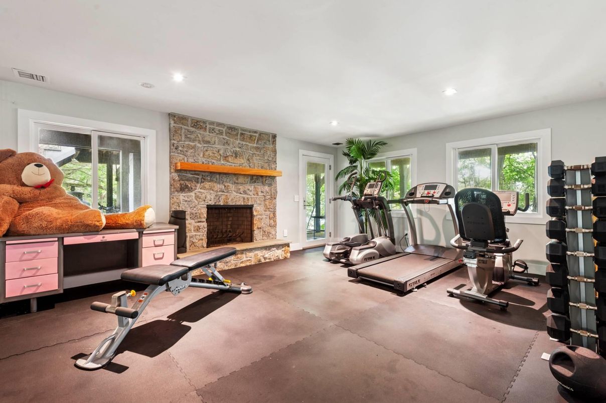 Fireplace, Fitness Equipment, Interior, Recessed Lighting, Stone Walls