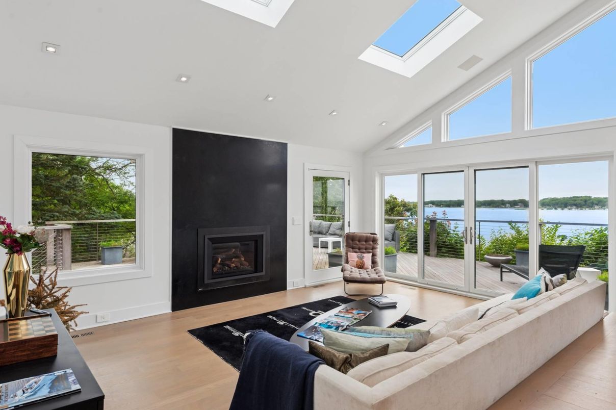 Fireplace, Interior, Living room, Recessed Lighting, Water, Wood Texture Flooring