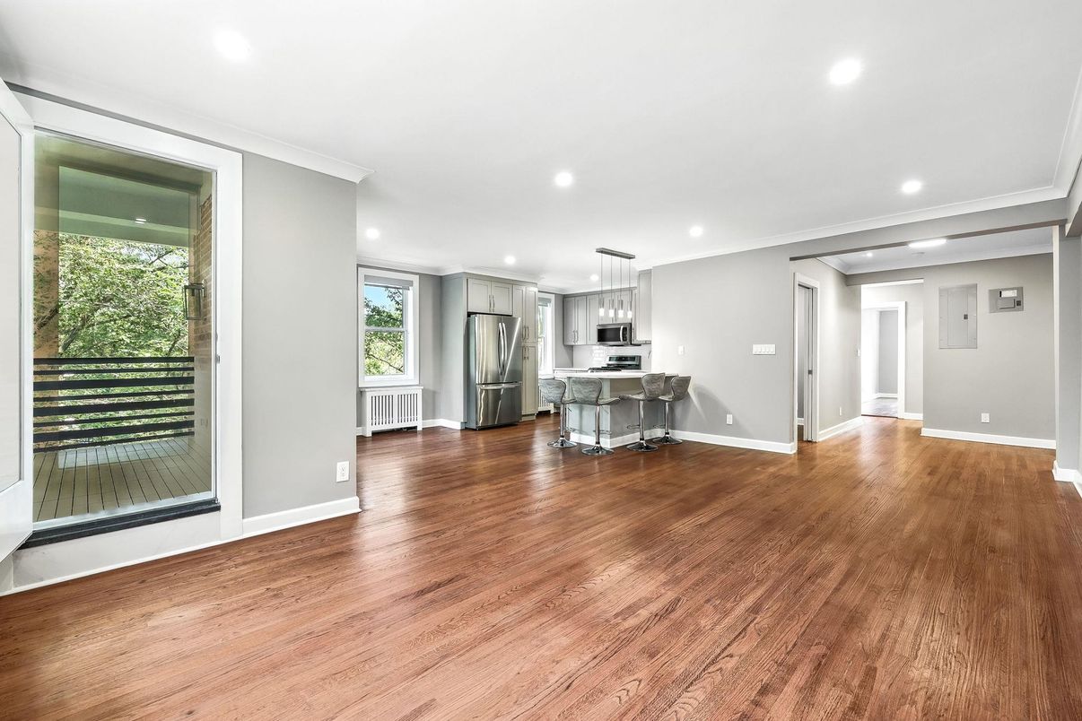 Empty room, Interior, Kitchen, Pendant Lights, Recessed Lighting, Stainless Steel Appliances, Wood Texture Flooring