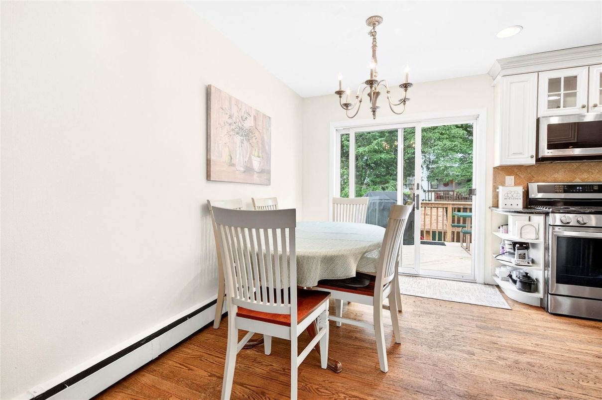 Chandelier, Dining room, Interior, Kitchen, Recessed Lighting, Stainless Steel Appliances, Wood Texture Flooring