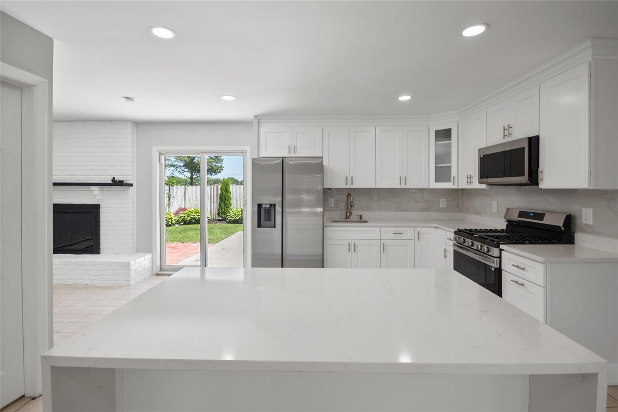 Fireplace, Interior, Kitchen, Recessed Lighting, Stainless Steel Appliances