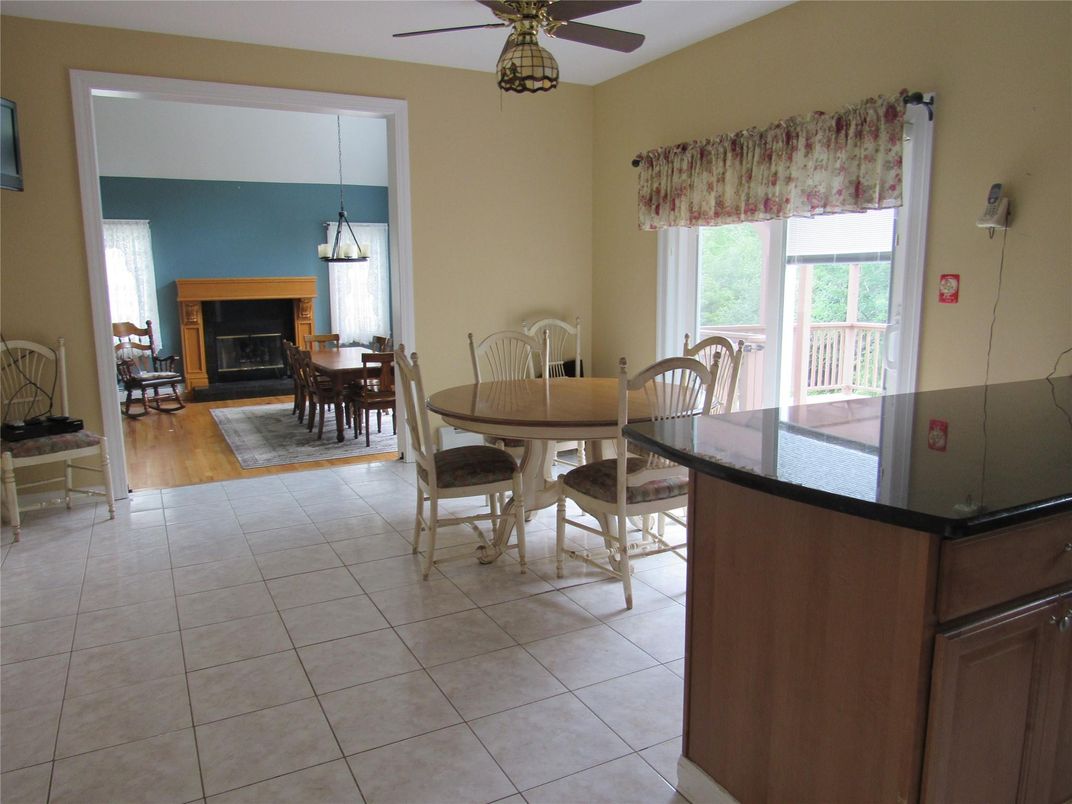 Dining room, Fireplace, Interior, Pendant Lights, Wood Texture Flooring