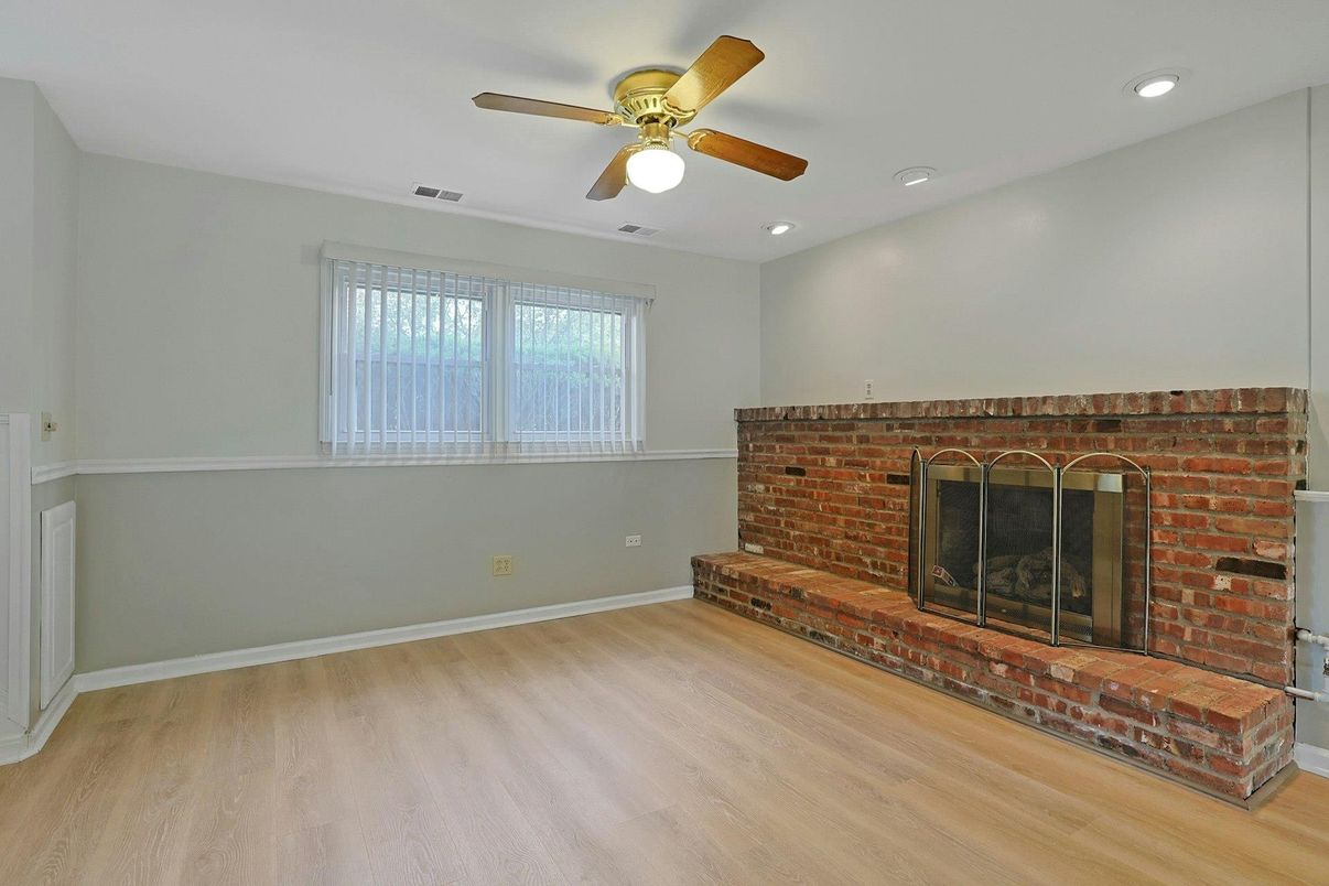 Empty room, Fireplace, Interior, Recessed Lighting, Stone Walls, Wood Texture Flooring