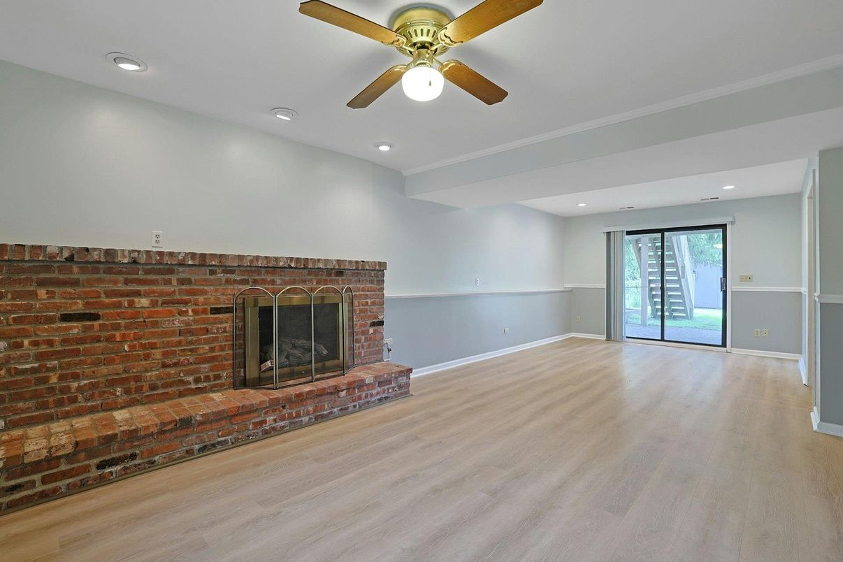 Empty room, Fireplace, Interior, Recessed Lighting, Stone Walls, Wood Texture Flooring