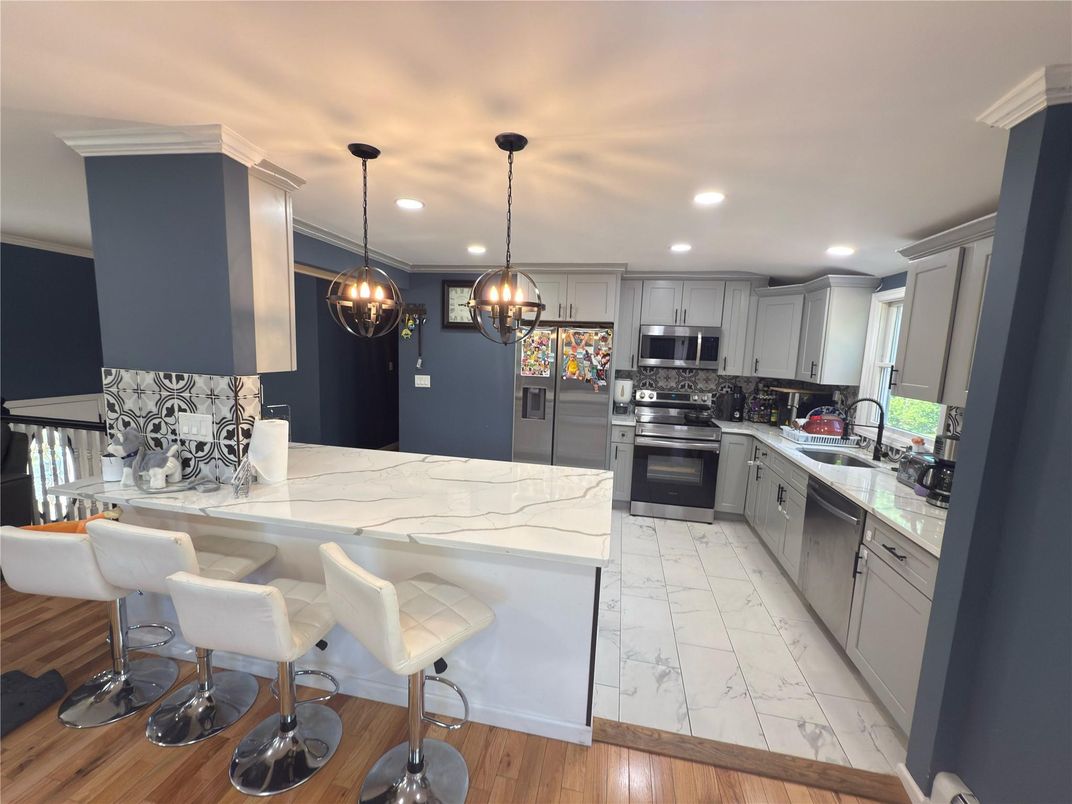 Interior, Kitchen, Marble, Pendant Lights, Recessed Lighting, Stainless Steel Appliances, Wood Texture Flooring