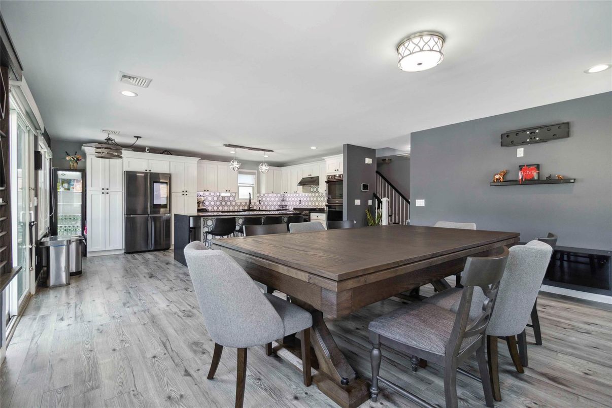 Dining room, Interior, Kitchen, Pendant Lights, Recessed Lighting, Stainless Steel Appliances, Wood Texture Flooring