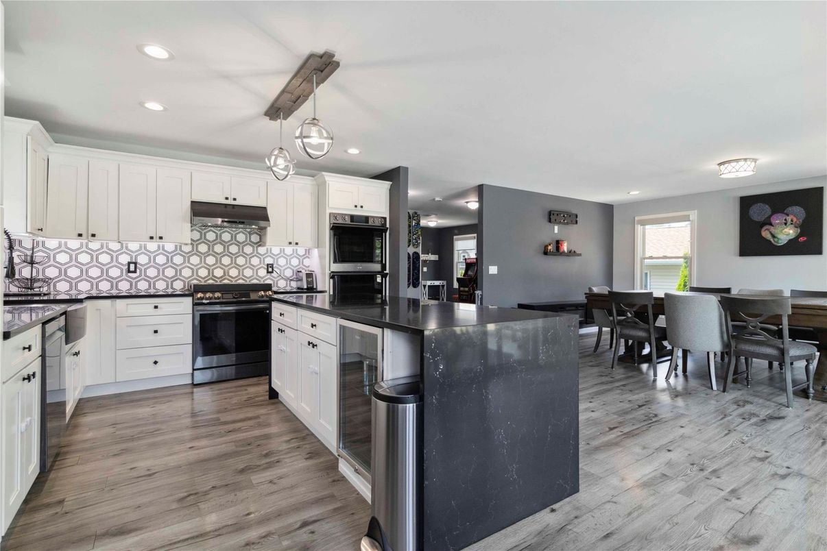 Dining room, Interior, Kitchen, Pendant Lights, Recessed Lighting, Stainless Steel Appliances, Wood Texture Flooring