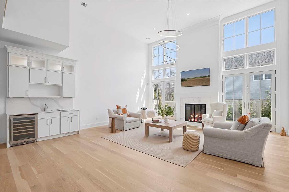 Fireplace, Interior, Living room, Marble Walls, Pendant Lights, Recessed Lighting, Wood Texture Flooring