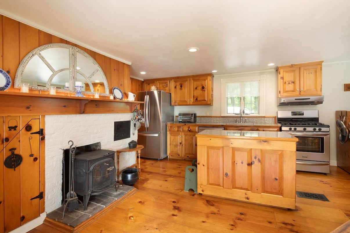 Fireplace, Interior, Kitchen, Recessed Lighting, Stainless Steel Appliances, Wood Texture Flooring