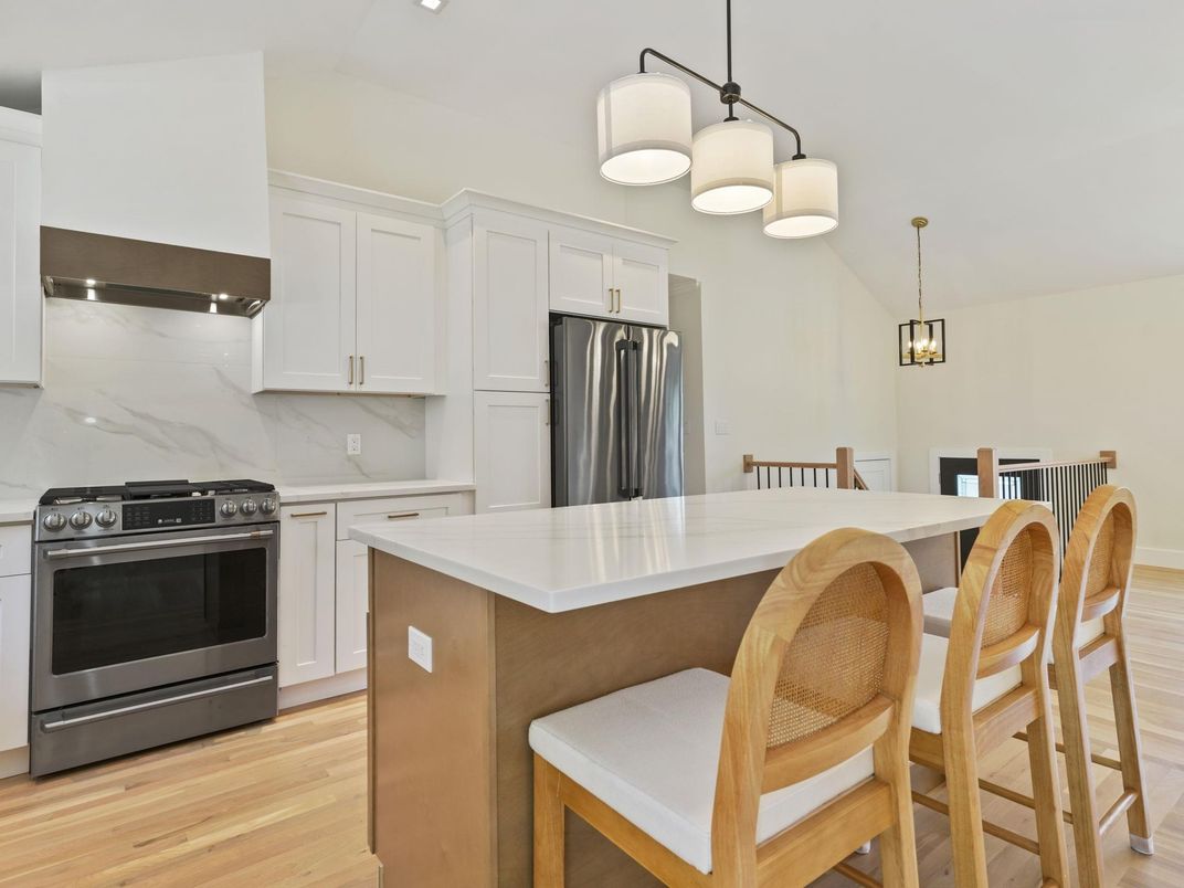 Interior, Kitchen, Marble Walls, Pendant Lights, Stainless Steel Appliances, Wood Texture Flooring
