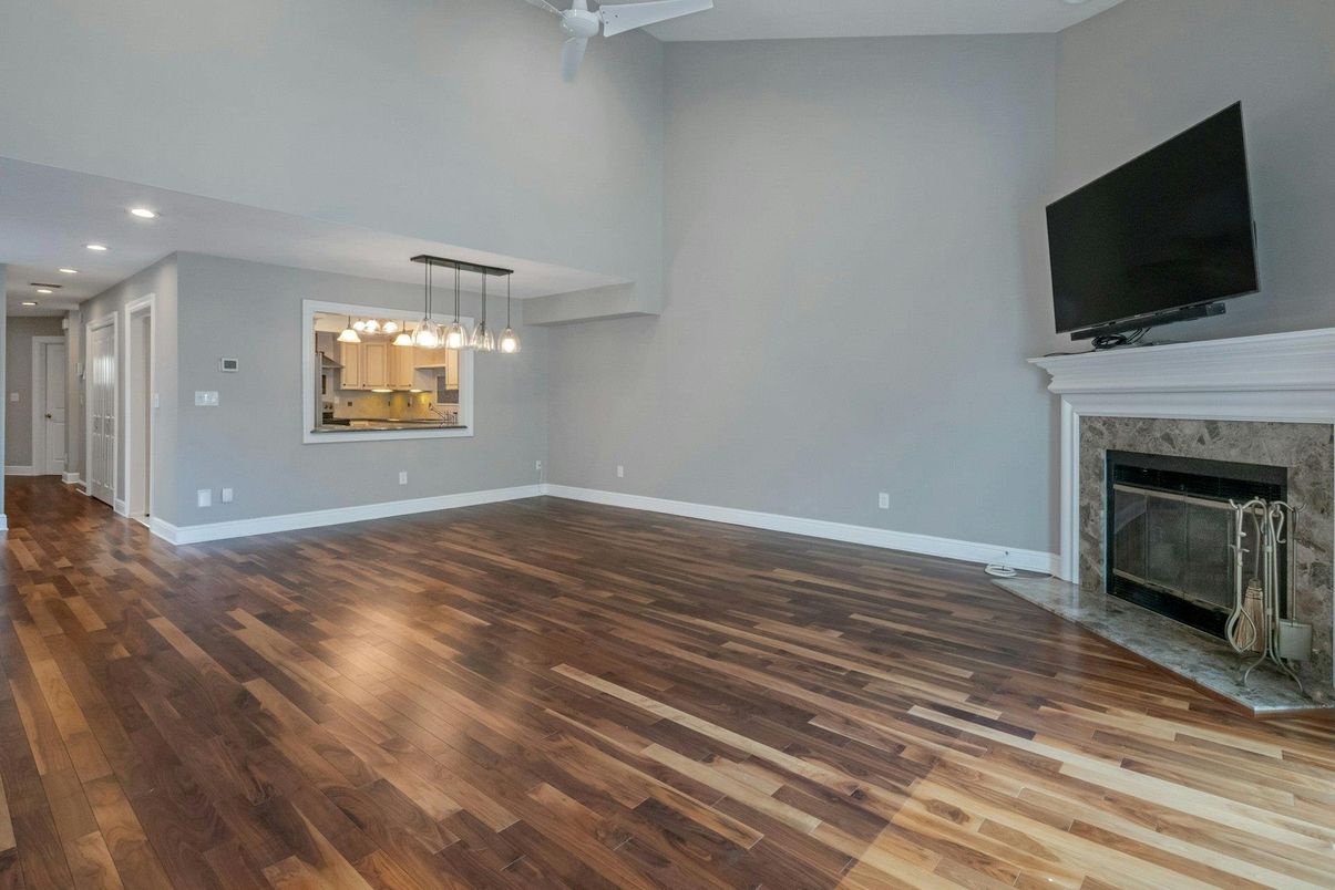 Empty room, Fireplace, Interior, Pendant Lights, Recessed Lighting, Wood Texture Flooring