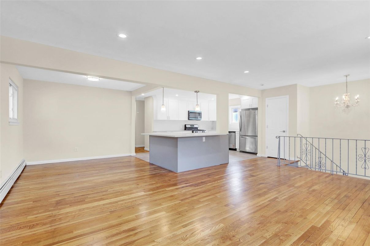 Chandelier, Empty room, Interior, Kitchen, Pendant Lights, Recessed Lighting, Stainless Steel Appliances, Wood Texture Flooring