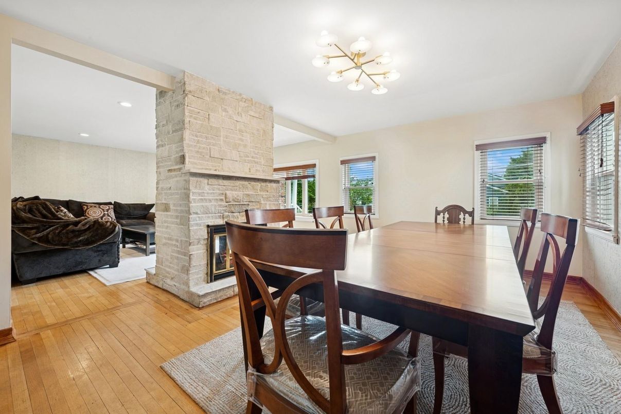 Dining room, Fireplace, Interior, Recessed Lighting, Stone Walls, Wood Texture Flooring