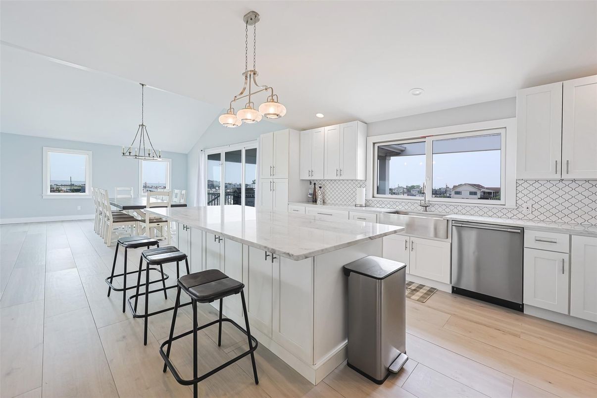Dining room, Interior, Kitchen, Pendant Lights, Recessed Lighting, Stainless Steel Appliances, Wood Texture Flooring