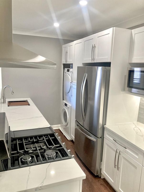Interior, Kitchen, Recessed Lighting, Washer, Wood Texture Flooring