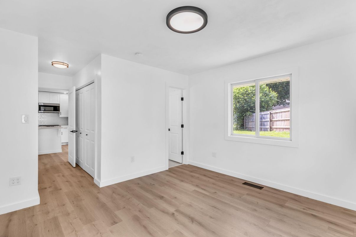 Empty room, Interior, Kitchen, Stainless Steel Appliances, Wood Texture Flooring