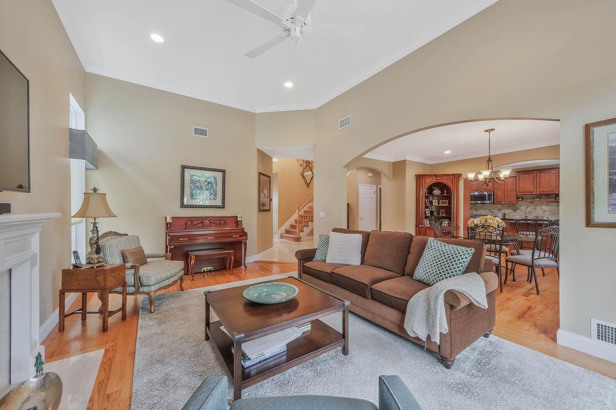 Chandelier, Dining room, Fireplace, Interior, Living room, Piano, Recessed Lighting, Wood Texture Flooring