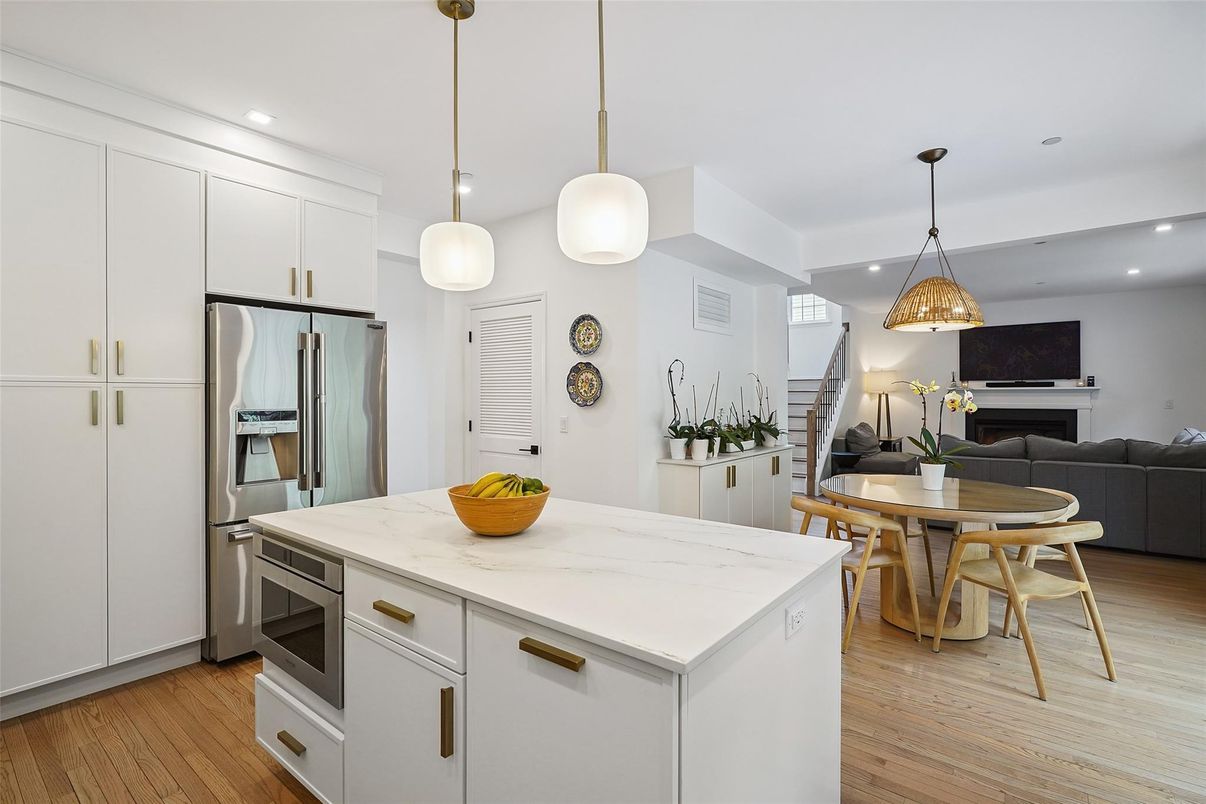 Dining room, Fireplace, Interior, Kitchen, Living room, Pendant Lights, Recessed Lighting, Stainless Steel Appliances, Wood Texture Flooring