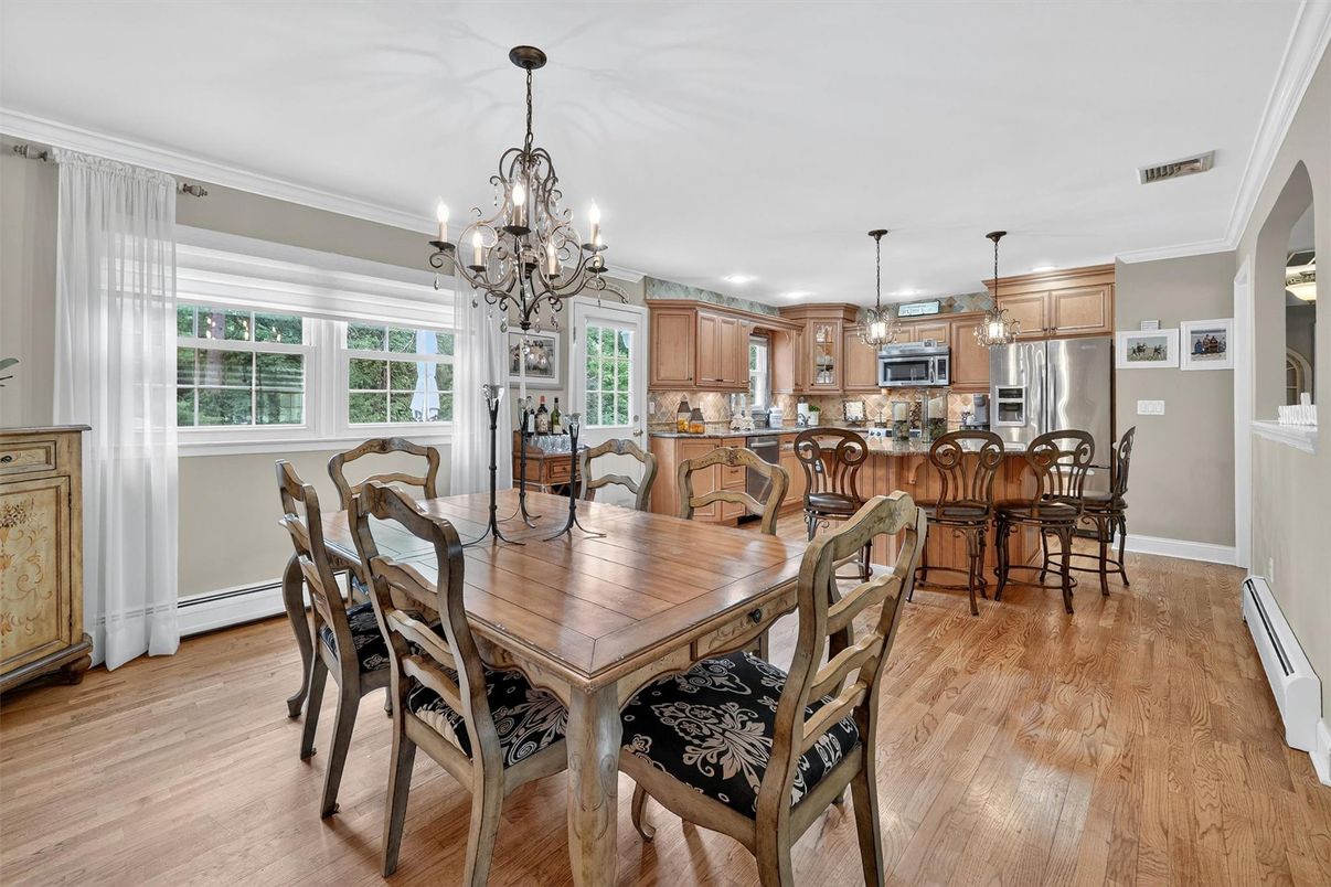Chandelier, Dining room, Interior, Kitchen, Pendant Lights, Stainless Steel Appliances, Wood Texture Flooring