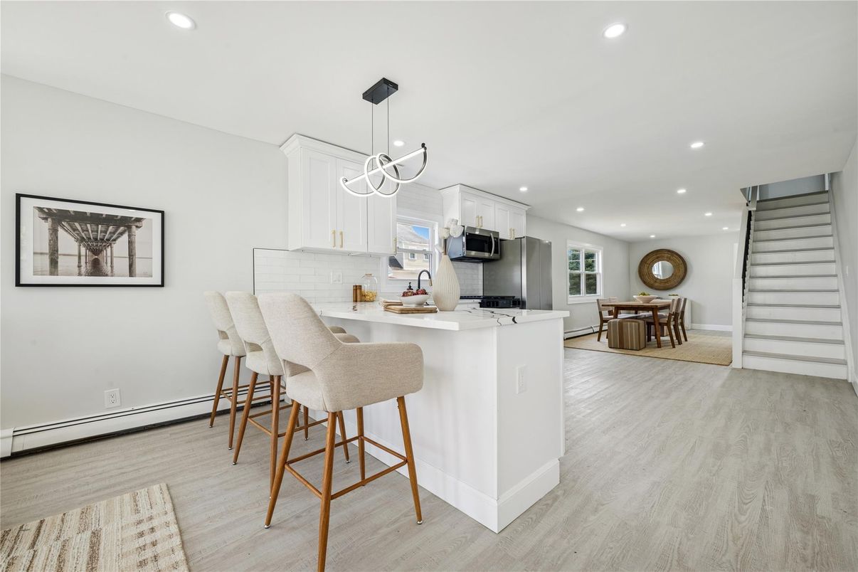 Dining room, Interior, Kitchen, Pendant Lights, Recessed Lighting, Stainless Steel Appliances, Wood Texture Flooring