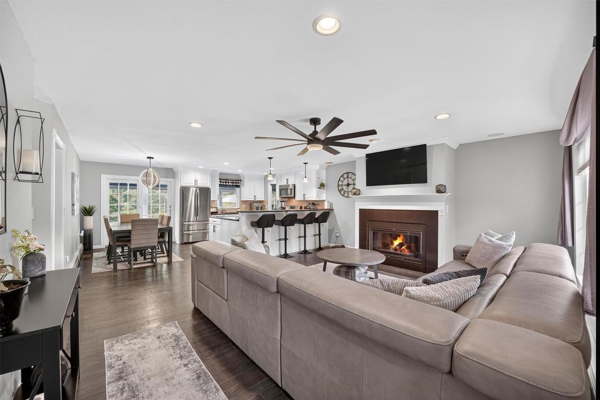 Dining room, Fireplace, Interior, Kitchen, Living room, Pendant Lights, Recessed Lighting, Stainless Steel Appliances, Wood Texture Flooring