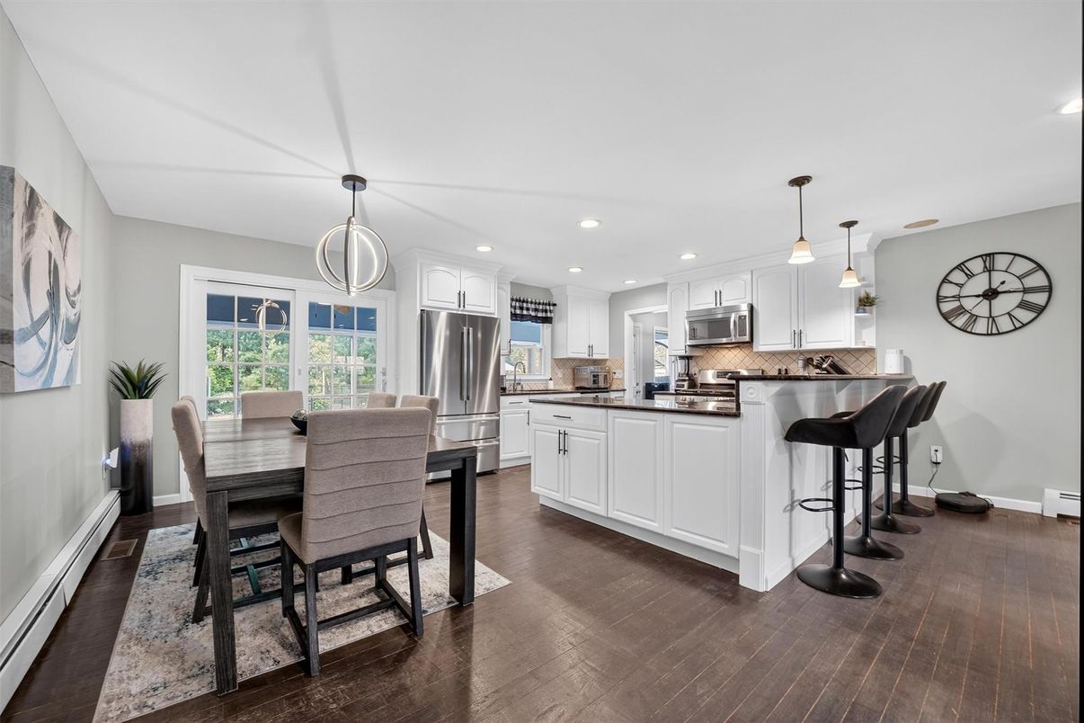 Dining room, Interior, Kitchen, Pendant Lights, Recessed Lighting, Stainless Steel Appliances, Wood Texture Flooring