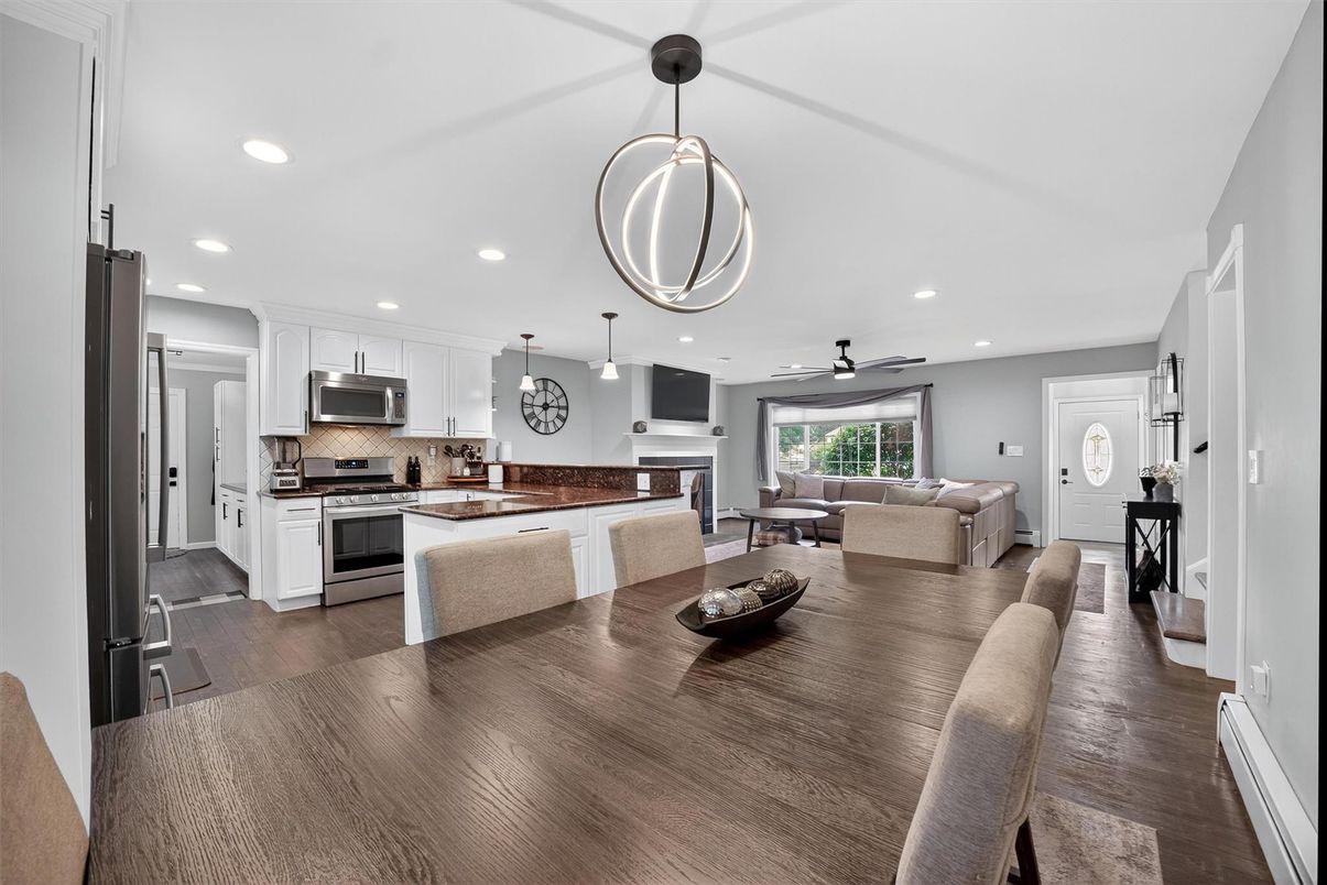 Dining room, Fireplace, Interior, Kitchen, Living room, Pendant Lights, Recessed Lighting, Stainless Steel Appliances, Wood Texture Flooring