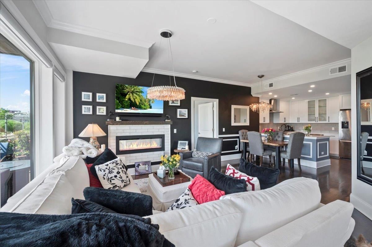 Chandelier, Dining room, Fireplace, Interior, Kitchen, Living room, Pendant Lights, Recessed Lighting, Wood Texture Flooring