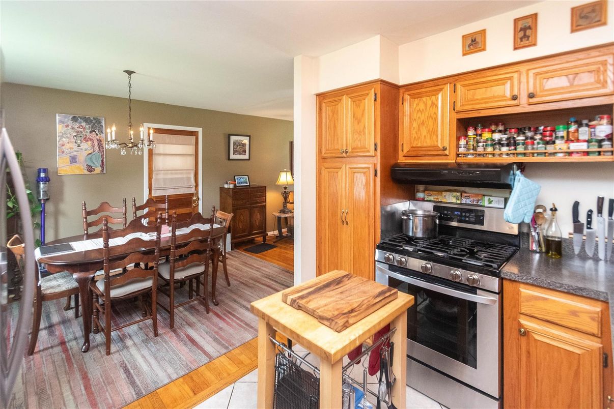 Chandelier, Dining room, Interior, Kitchen, Pendant Lights, Stainless Steel Appliances, Wood Texture Flooring