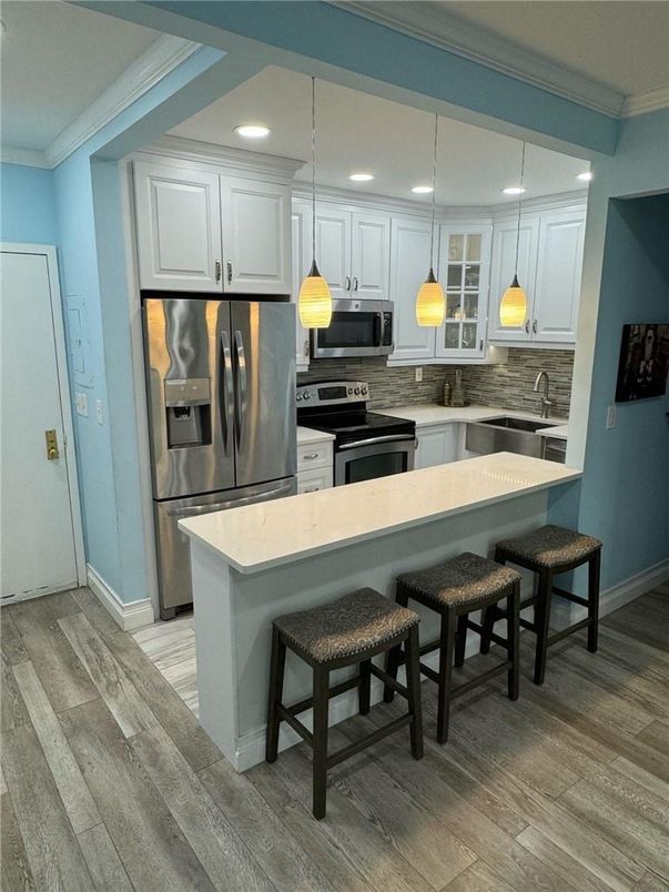 Interior, Kitchen, Pendant Lights, Recessed Lighting, Stainless Steel Appliances, Wood Texture Flooring