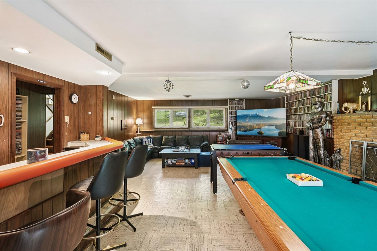 Billiard Table, Fireplace, Game Room, Interior, Living room, Pendant Lights, Recessed Lighting, Stone Walls, Wooden Walls