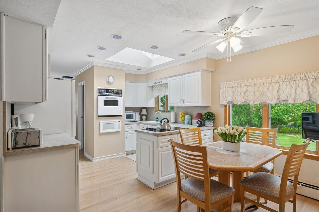 Dining room, Interior, Kitchen, Recessed Lighting, Stainless Steel Appliances, Wood Texture Flooring