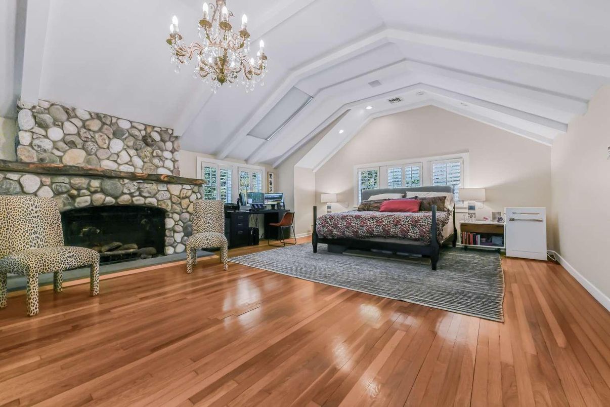 Bedroom, Chandelier, Fireplace, Interior, Recessed Lighting, Wood Texture Flooring