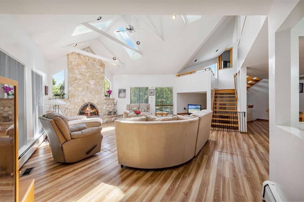 Fireplace, Interior, Living room, Recessed Lighting, Stone Walls, Wood Texture Flooring
