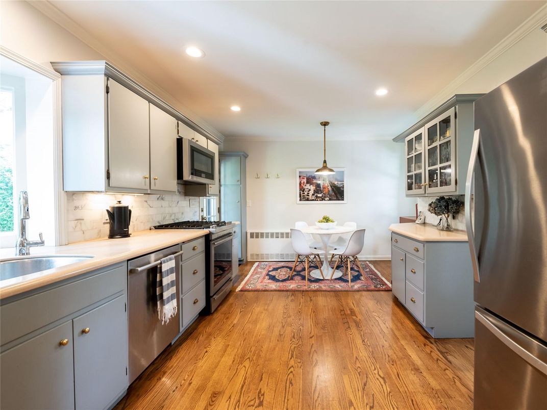 Dining room, Interior, Kitchen, Pendant Lights, Recessed Lighting, Stainless Steel Appliances, Wood Texture Flooring