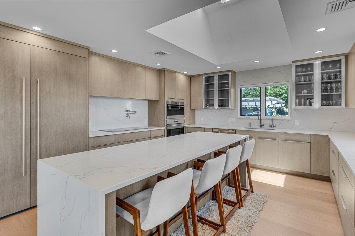 Interior, Kitchen, Marble Walls, Recessed Lighting, Stainless Steel Appliances, Wood Texture Flooring