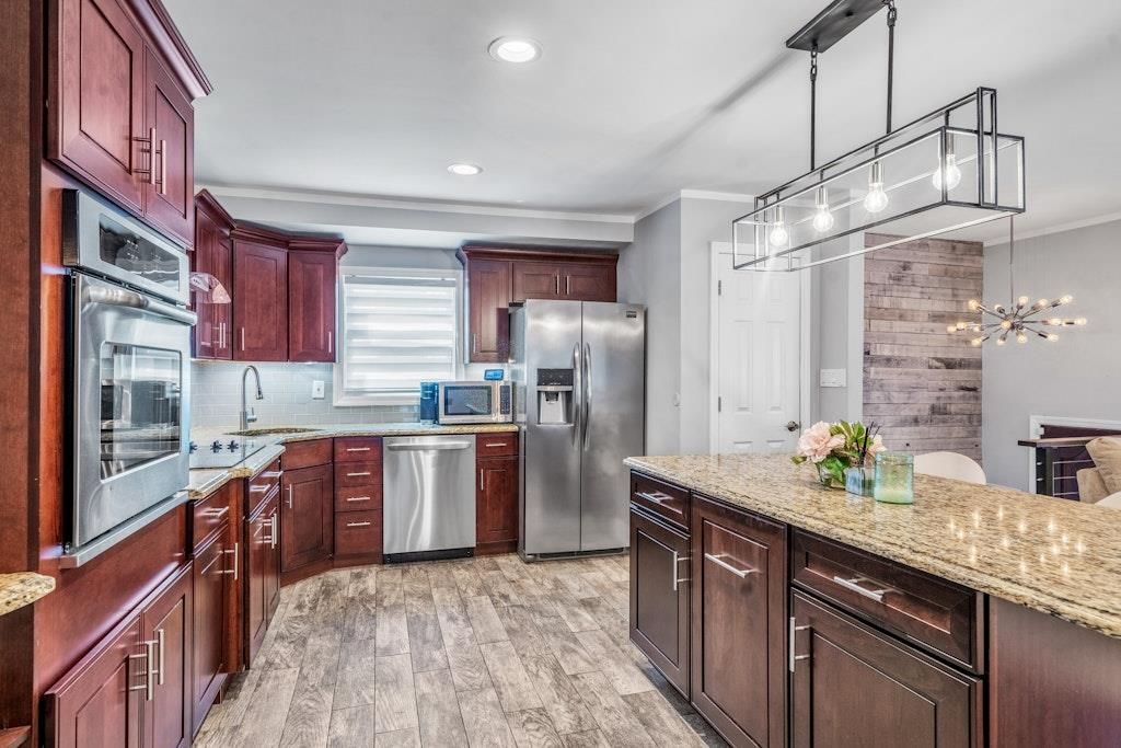 Interior, Kitchen, Pendant Lights, Recessed Lighting, Stainless Steel Appliances, Stone Walls, Wood Texture Flooring