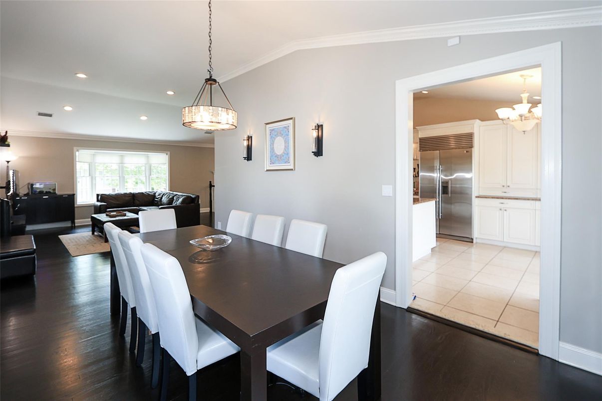 Chandelier, Dining room, Interior, Kitchen, Living room, Pendant Lights, Recessed Lighting, Stainless Steel Appliances, Wood Texture Flooring