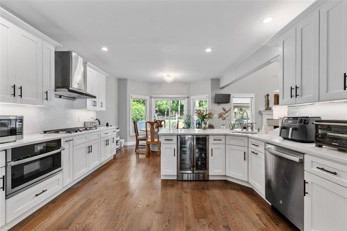 Dining room, Interior, Kitchen, Recessed Lighting, Stainless Steel Appliances, Wood Texture Flooring