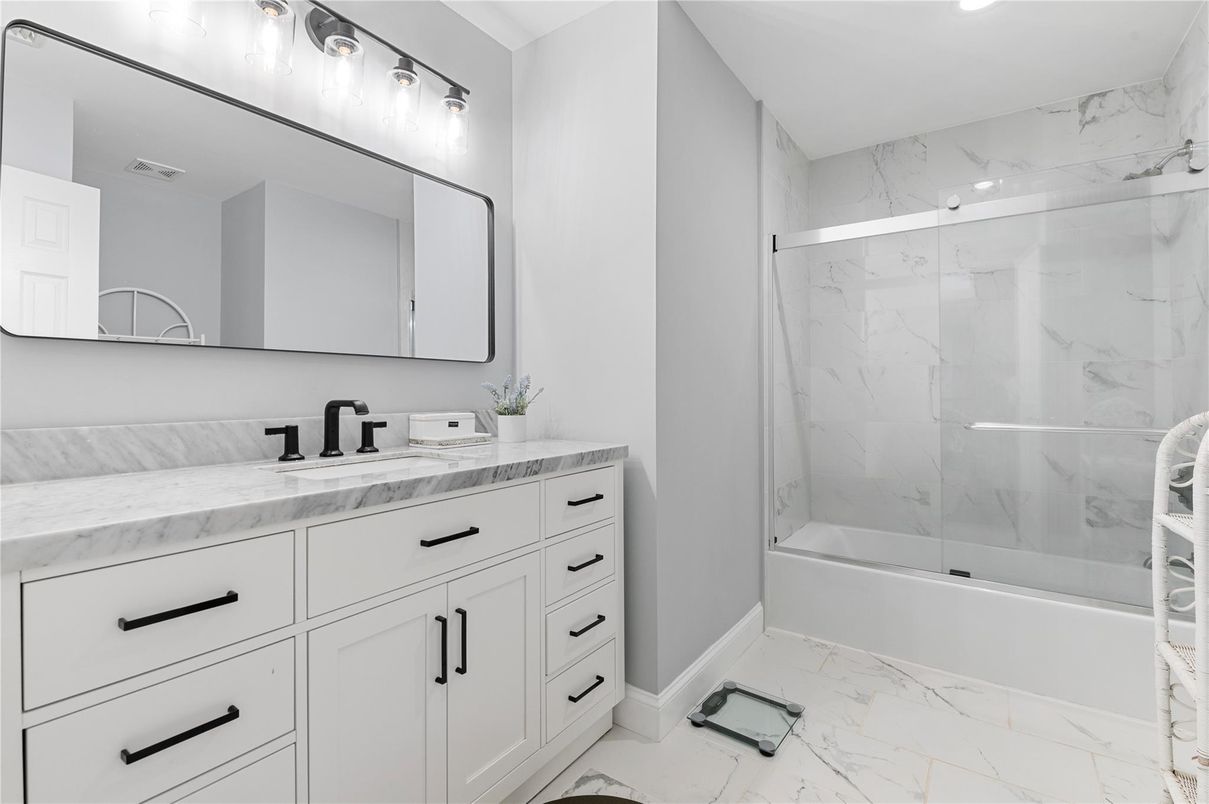 Bathroom, Dual Sink Vanities, Glass Shower, Interior, Marble, Marble Walls, Recessed Lighting