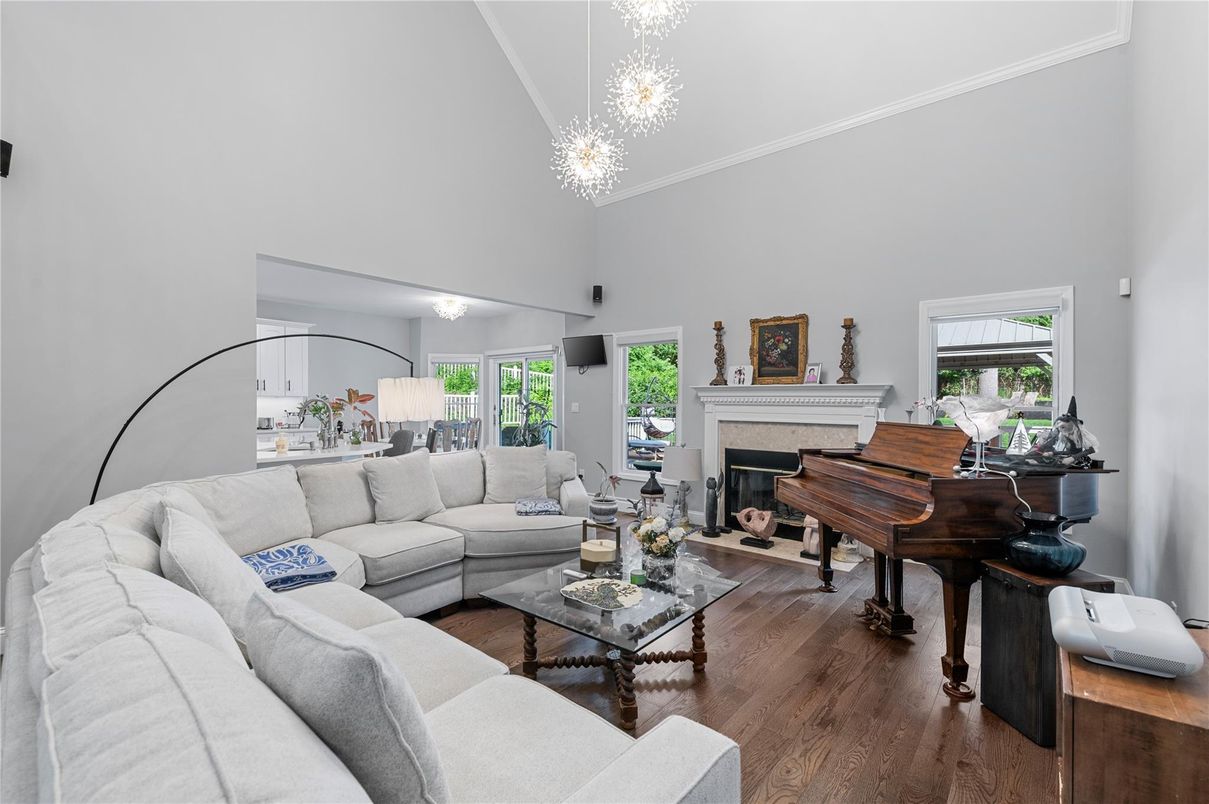 Chandelier, Fireplace, Interior, Living room, Piano, Wood Texture Flooring