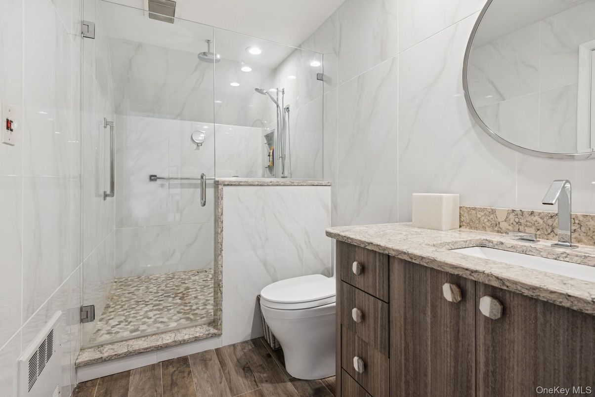 Bathroom, Glass Shower, Interior, Marble Walls, Recessed Lighting, Wood Texture Flooring