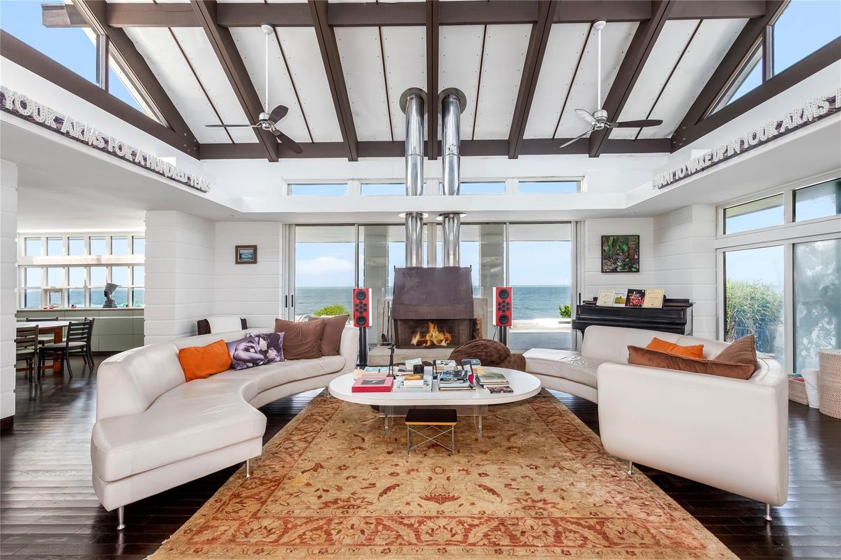 Dining room, Fireplace, Interior, Living room, Pendant Lights, Water, Wooden Beams, Wood Texture Flooring