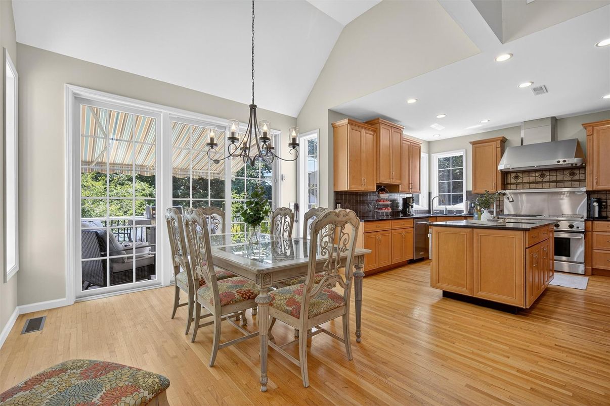 Chandelier, Dining room, Interior, Kitchen, Recessed Lighting, Stainless Steel Appliances, Wood Texture Flooring