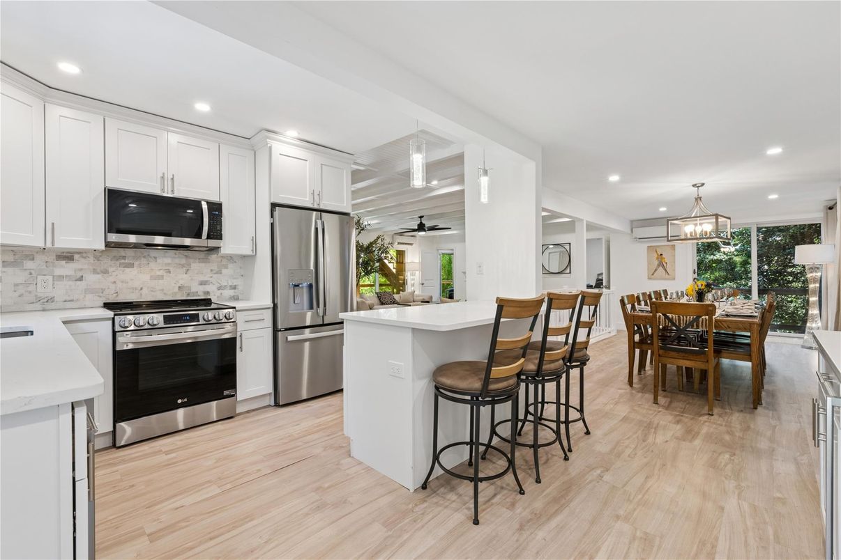 Dining room, Interior, Kitchen, Pendant Lights, Recessed Lighting, Stainless Steel Appliances, Wood Texture Flooring