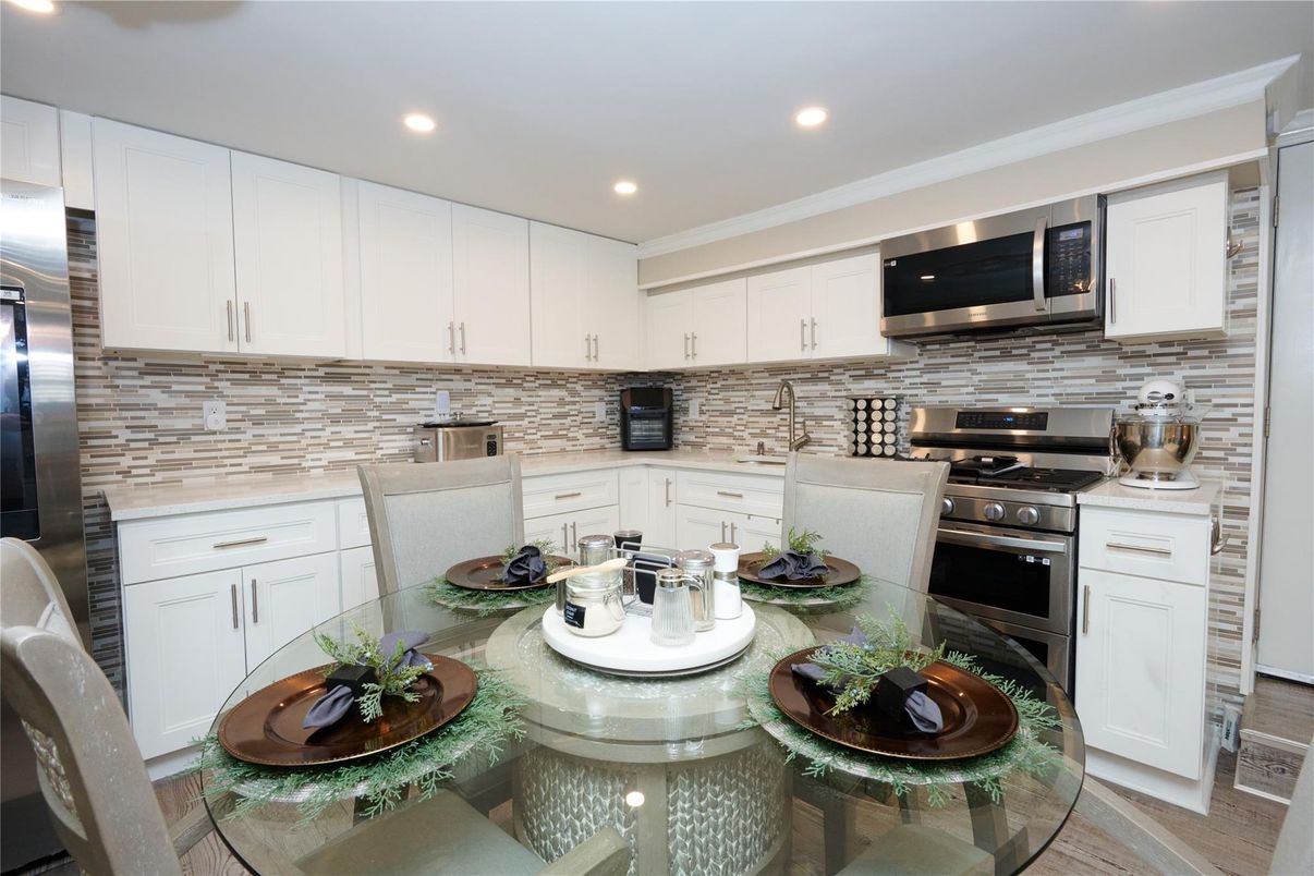 Dining room, Interior, Kitchen, Recessed Lighting, Stainless Steel Appliances, Wood Texture Flooring