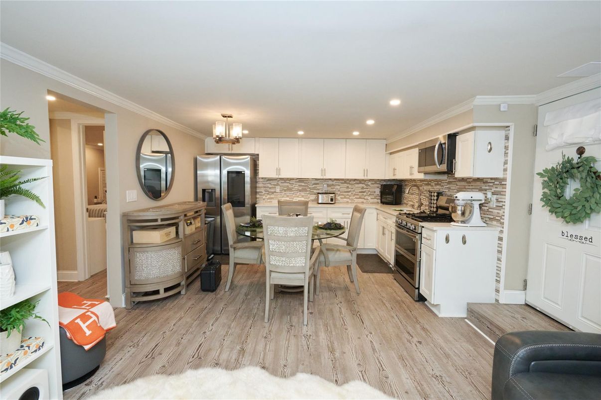 Dining room, Interior, Kitchen, Recessed Lighting, Stainless Steel Appliances, Wood Texture Flooring