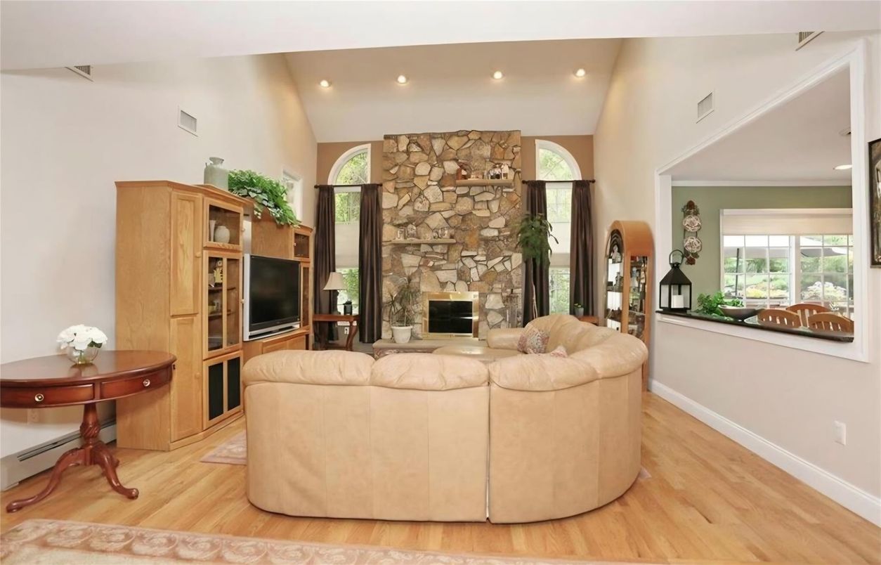 Fireplace, Interior, Living room, Recessed Lighting, Stone Walls, Wood Texture Flooring