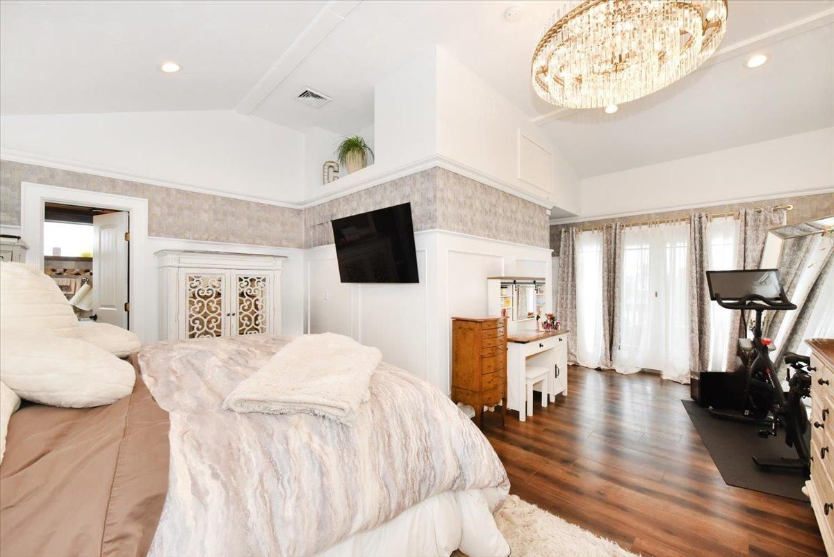Bedroom, Chandelier, Fitness Equipment, Interior, Recessed Lighting, Wood Texture Flooring