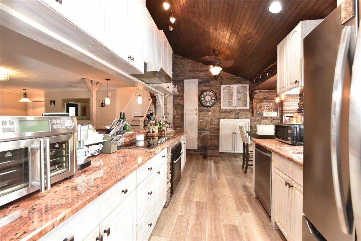 Interior, Kitchen, Pendant Lights, Recessed Lighting, Stainless Steel Appliances, Stone Walls, Wooden Ceilings, Wood Texture Flooring